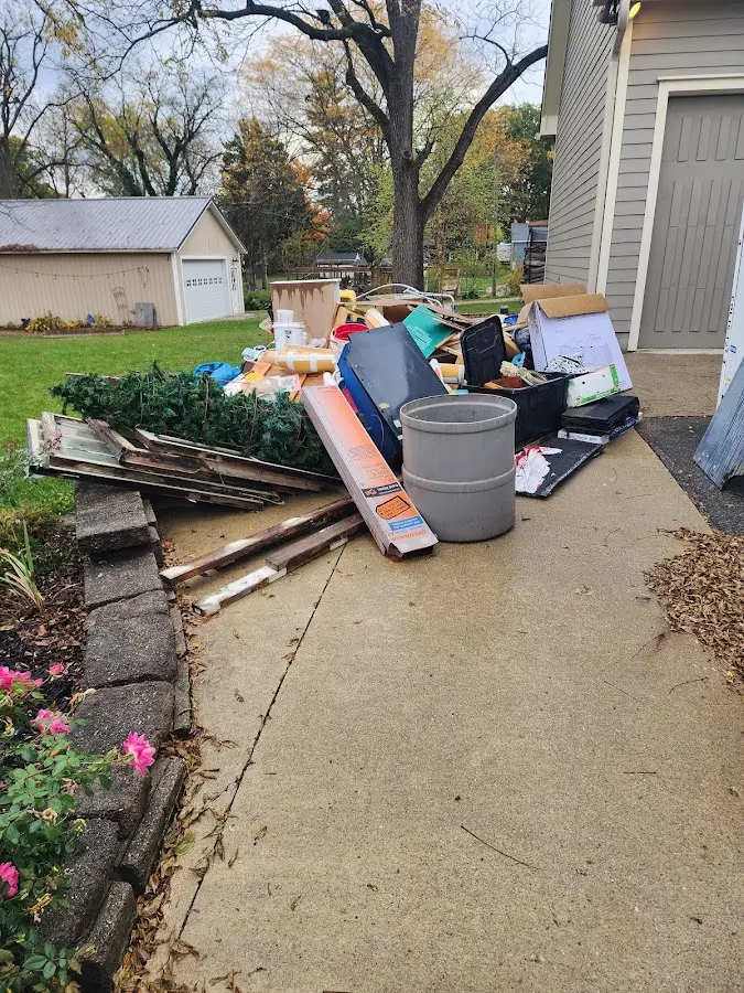 Dumpster being loaded with debris for 30 Yard Dumpster Rental in Londonderry